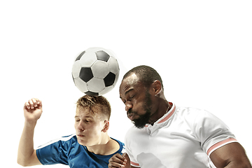 Image showing Close up of emotional men playing soccer hitting the ball with the head on isolated on white background