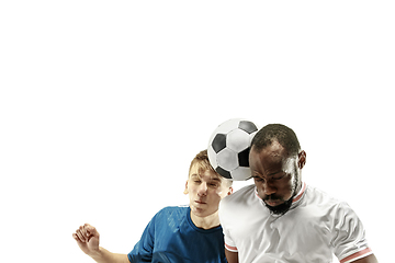 Image showing Close up of emotional men playing soccer hitting the ball with the head on isolated on white background