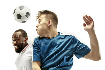 Image showing Close up of emotional men playing soccer hitting the ball with the head on isolated on white background