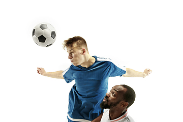 Image showing Close up of emotional men playing soccer hitting the ball with the head on isolated on white background