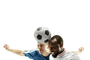 Image showing Close up of emotional men playing soccer hitting the ball with the head on isolated on white background