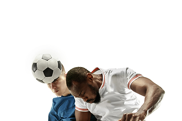 Image showing Close up of emotional men playing soccer hitting the ball with the head on isolated on white background