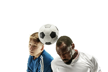Image showing Close up of emotional men playing soccer hitting the ball with the head on isolated on white background