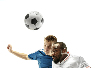 Image showing Close up of emotional men playing soccer hitting the ball with the head on isolated on white background