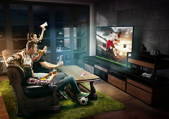 Image showing Group of friends watching TV, football match, sport together