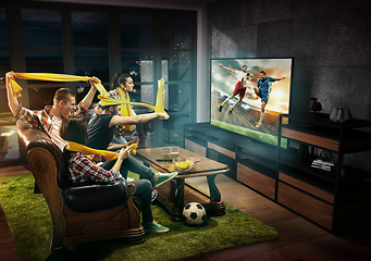 Image showing Group of friends watching TV, football match, sport together