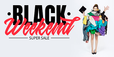 Image showing Woman addicted of sales and clothes, black weekend, sales concept