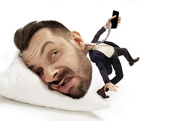 Image showing Big head on small body lying on the pillow