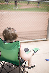 Image showing woman watching baseball