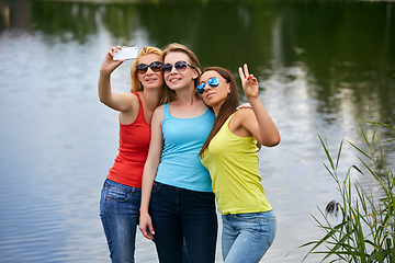 Image showing three girls having fun outdoors