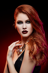 Image showing beautiful girl with bright makeup and red hair