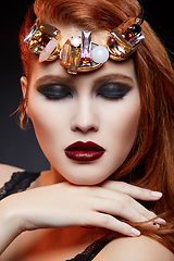 Image showing beautiful girl with bright makeup and red hair