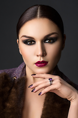 Image showing beautiful young woman with dark makeup