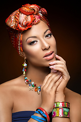 Image showing beautiful mulatto young woman with turban on head