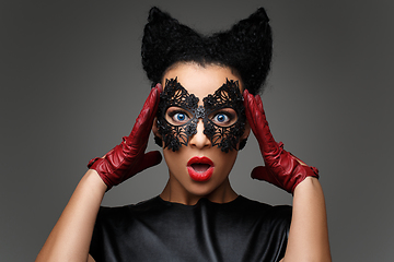 Image showing girl with horns hairstyle in leather mask