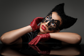 Image showing girl with horns hairstyle in leather mask