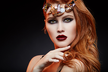 Image showing beautiful girl with bright makeup and red hair