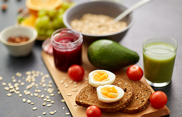 Image showing toast bread, eggs, avocado, jam, tomato and juice