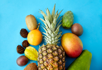 Image showing many different exotic fruits on blue background