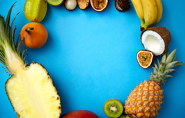 Image showing different exotic fruits on blue background