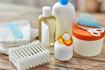 Image showing baby accessories for bathing on wooden table