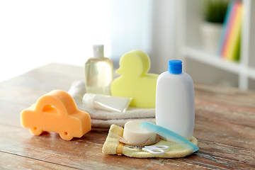 Image showing baby accessories for bathing on wooden table