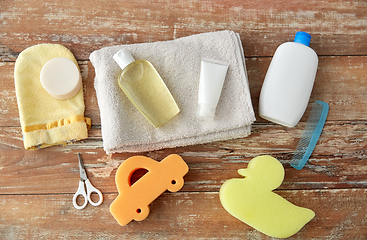 Image showing baby accessories for bathing on wooden table