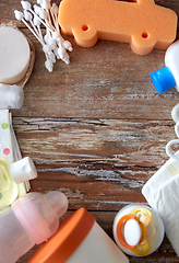 Image showing baby accessories for bathing on wooden table