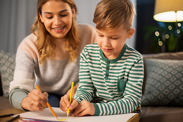 Image showing mother and son with pencils drawing at home