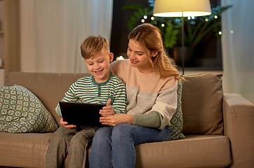 Image showing mother and son using tablet computer at home