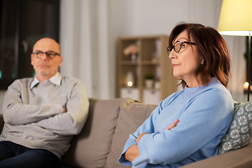 Image showing unhappy senior couple sitting on sofa at home