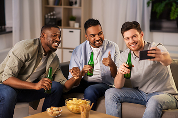 Image showing male friends with smartphone taking selfie at home