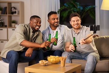 Image showing male friends with smartphone taking selfie at home