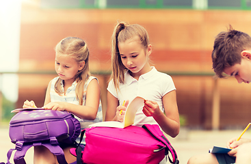 Image showing group of happy elementary school students outdoors