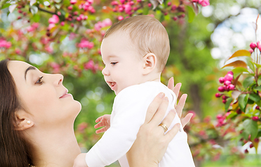 Image showing mother with baby over spring garden background