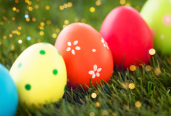 Image showing row of colored easter eggs on artificial grass