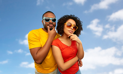 Image showing african couple in sunglasses thinking