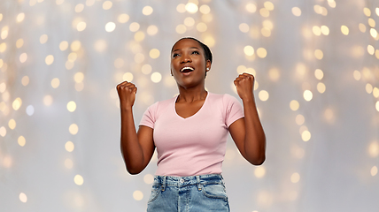 Image showing happy african american woman celebrating success