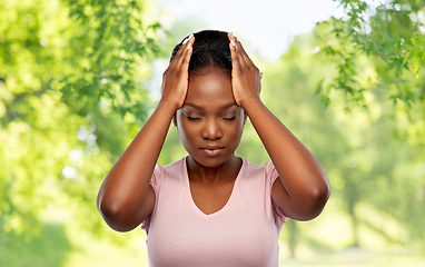 Image showing african american woman suffering from headache