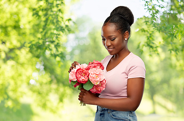 Image showing happy african american woman with bunch of flowers