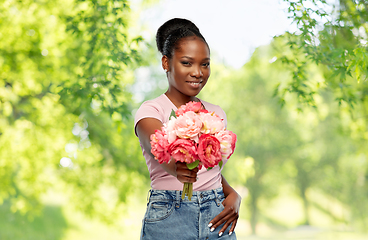 Image showing happy african american woman with bunch of flowers