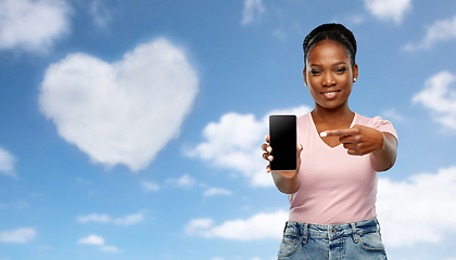 Image showing happy african american woman using smartphone