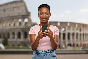 Image showing african american woman with smartphone at coliseum