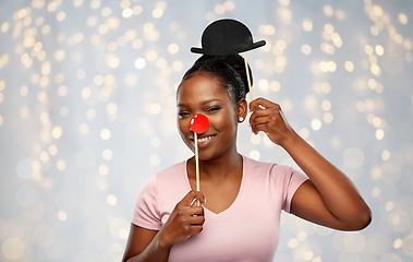 Image showing happy african american woman with red clown nose