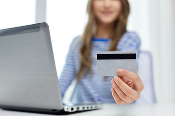 Image showing teenage girl with laptop and credit card at home