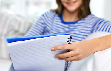 Image showing close up of student girl with exercise book