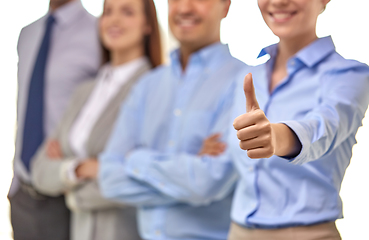 Image showing close up of happy businesswoman showing thumbs up