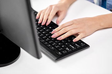 Image showing female hands typing on computer keyboard