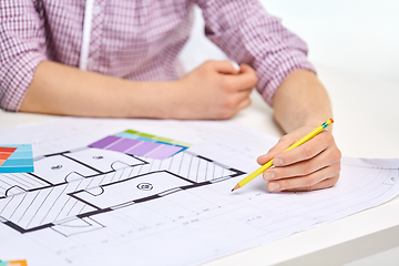 Image showing architect with blueprint and color palettes