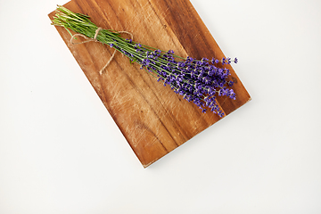 Image showing bunch of lavender flowers on wooden board